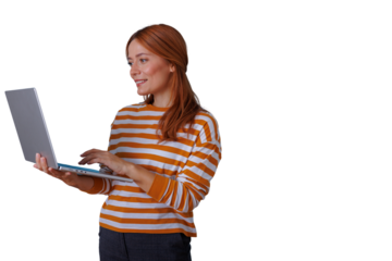 Woman using laptop, working remotely, smiling, redhead, standing, transparent background for easy integration