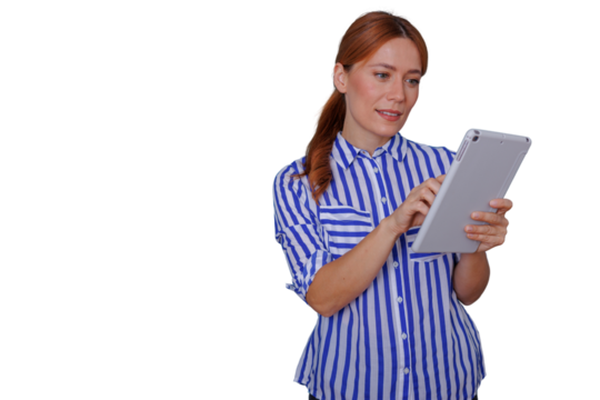 Professional woman using digital tablet, redhead employee busy with technology device, researching, working