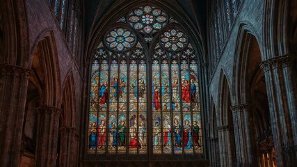At start, camera zooming into glass lancets, rose window inside cathedral nave, revealing details - Powered by Adobe