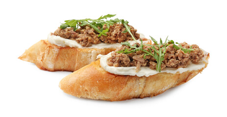 Delicious bruschettas with tuna, cream cheese and arugula isolated on white