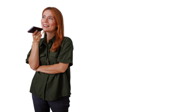 Happy woman recording voice message on mobile phone using speakerphone, modern communication technology