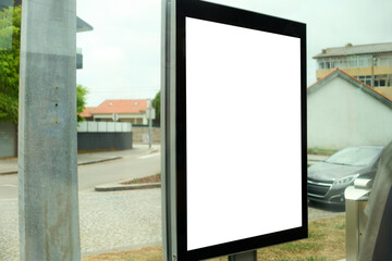 Empty white billboard on pedestrian city street