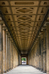 Classical architecture with perfect symmetry and deep perspective. Ancient colonnade.