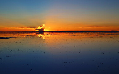 Reflection of the Sunset Sky on the Flooding Salt Flats, the Iconic Mirror Effect at Salar de Uyuni in Bolivia, South America
