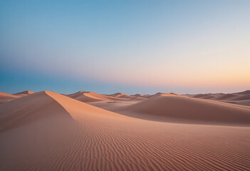 Beautiful sand dunes in desert landscape at sunset, soft golden light and clear blue sky creating natural texture and peaceful environment, minimal travel and nature background
