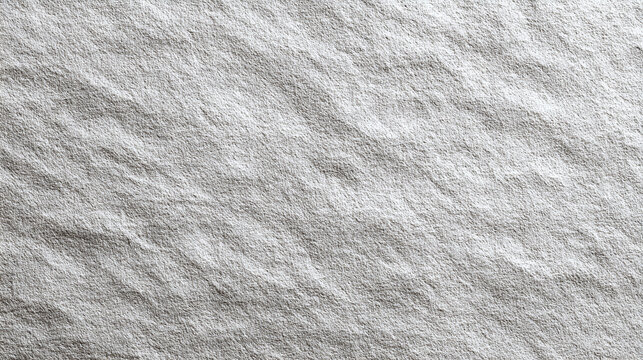 A close-up view of textured grey stone surface, showcasing a rough, weathered appearance. The detailed pattern provides a sense of depth and tactile quality