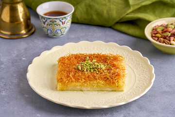   Middle eastern sweets kunefe, kunafa, kadayif with pistachio and syrup .Turkish , arabic traditional dessert