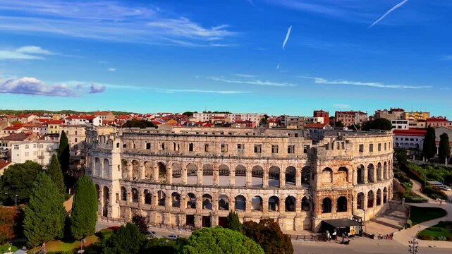 Cinematic Aerial View of Pula, Croatia &ndash; Ancient Roman Amphitheatre, Historic City and Adriatic Coastline from Drone