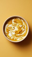 Creamy lentil curry swirled with coconut milk, dish from Sri Lanka on yellow background, minimalist food photo, template for social media, digital ads, web banners, mobile wallpapers, greeting cards