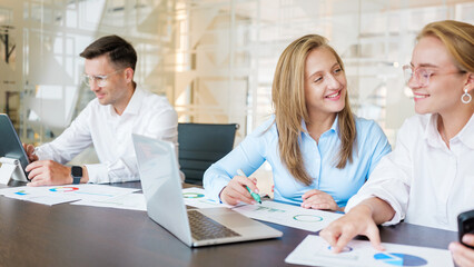 Team members discussing project data in office