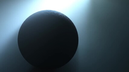 A textured sphere is illuminated by a spotlight against a shadowed backdrop - Powered by Adobe
