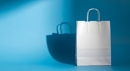 Minimalist shopping bag on blue background with shadow.