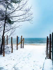 Snowy Path to the Sea on a Cold Day. Winter Beach.