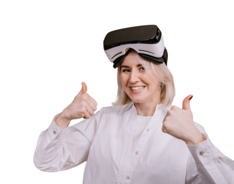 Excited Blonde caucasian woman in white shirt and virtual headset on forehead looks at camera stands against transparent background shows thumb up gesture. Future technologies, leisure activities