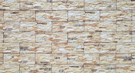 Stoneware coating wall with rock effect. Colors are flaxen yellow, brown and white. Background and texture.