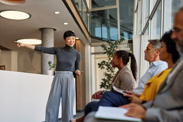 Portrait of a businesspeople sitting in chair and waiting for an interview for job application using a laptop and phone