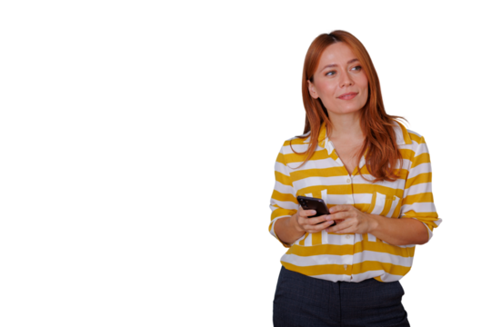 Redhead woman holding smartphone looking away, thinking about success, future opportunities, transparent background