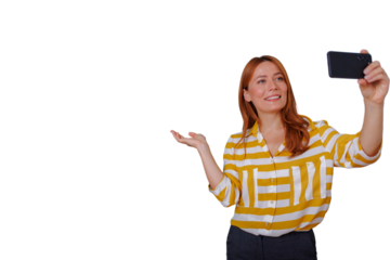 Woman red hair taking a selfie while presenting and smiling, transparent background for easy overlay