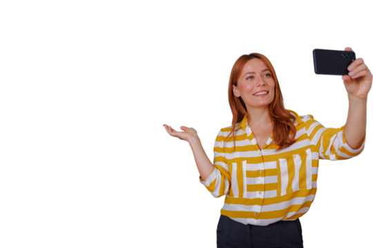 Woman red hair taking a selfie while presenting and smiling, transparent background for easy overlay