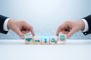Hands adjusting blocks symbolizing global business networking and transaction management. Suitable for presentations, websites, and articles on international commerce strategies.