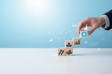 Hand stacking wooden blocks with financial growth symbols. Ideal for finance, investment, success, growth concepts in presentations, websites, and social media posts.