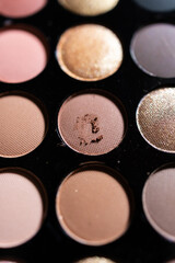 Colorful eyeshadow palette with a variety of bright and neutral shades for makeup and beauty concepts.