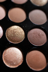 Colorful eyeshadow palette with a variety of bright and neutral shades for makeup and beauty concepts.