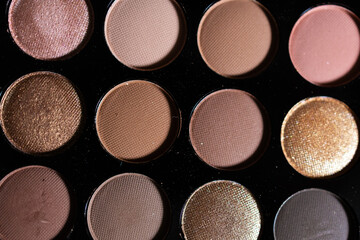 Colorful eyeshadow palette with a variety of bright and neutral shades for makeup and beauty concepts