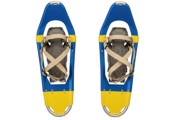 Isolated pair of blue and yellow snowshoes with khaki straps on ground for outdoor adventure