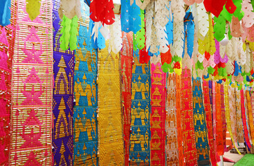Row of Multi-colored of Thailand Northern Region Traditional Long Flag Called Toong in Buddhist Temple
