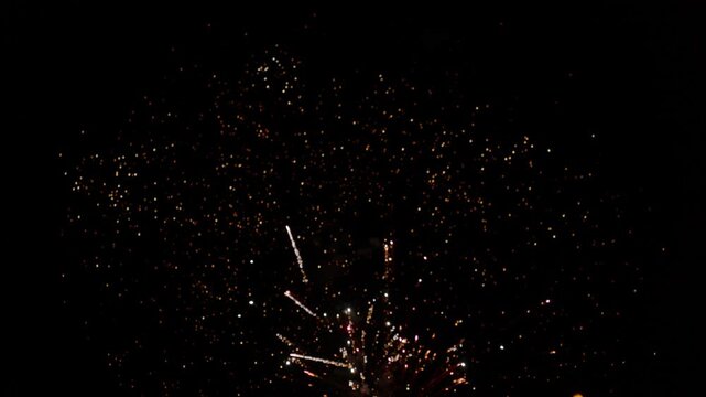 Fireworks twinkle and burst in the night sky in a dazzling display at a prestigious festival closing ceremony.