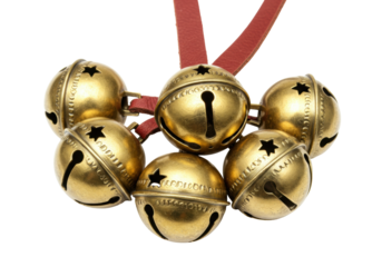 Isolated vintage antique brass sleigh bells on a strap festive jingle bells ornament décor