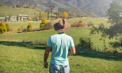 Man in straw hat at the nature.