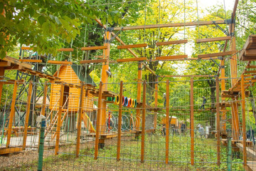 Fototapeta premium Wooden playground with a suspended ropes.