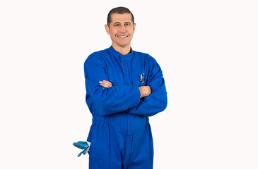 Portrait of confident mature mechanic in overalls with arm crossed and looking at camera isolated on white background