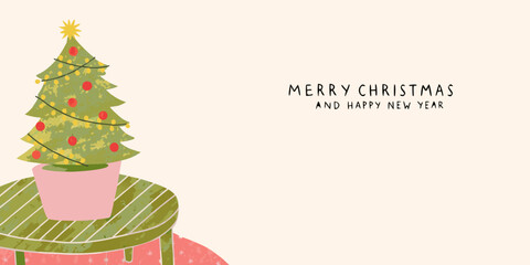 Charming hand drawn christmas tree with lights and ornaments on a festive table with merry christmas and happy new year text