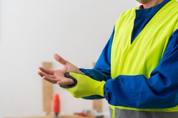 Hands, person and wrist pain with construction injury, work site accident or sprain with agony indoor. Joint ache, contractor with muscle tension or carpal tunnel, inflammation or fibromyalgia