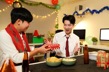 xmas business party, Friends celebrating holiday season in office environment with gift exchange