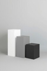 A pristine, modern studio setup featuring three sleek, minimalist rectangular pedestals arranged in a visually engaging, descending height sequence. The blocks showcase a gradient of shades from clean
