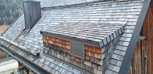 Cedar shake roof is an ecological roof covering for a house. Panorama of gray Cedar shake roof. © Tanya