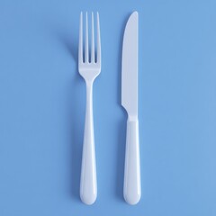 Fototapeta premium A Minimalist Arrangement of a White Fork and Knife Set Against a Soft Blue Background, Perfect for Culinary Themes or Dining Settings