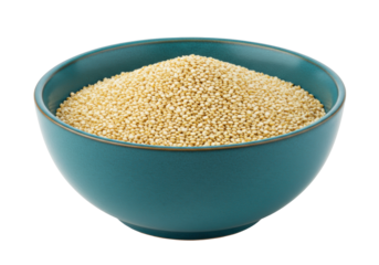 Isolated teal ceramic bowl filled to the brim with healthful, natural golden quinoa seeds