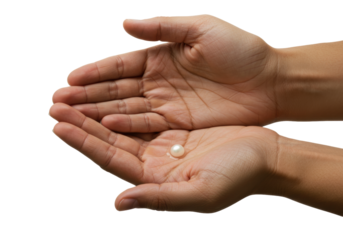 Isolated pearl in open hands symbolizing wealth, preciousness, purity, and generosity