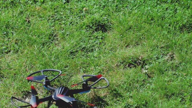 Drone unexpectedly lands on grassy ground during outdoor flight