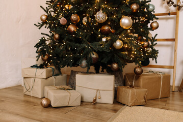 Gifts wrapped in eco-friendly kraft paper, reflecting a simple and stylish approach to holiday traditions. Above them shines a festive Christmas tree with lights. An atmosphere of harmony and simplici