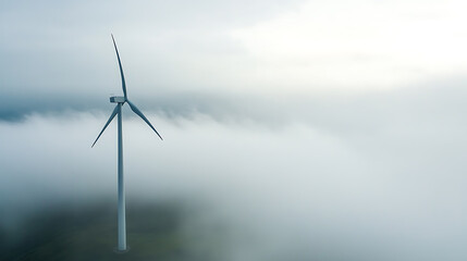 Aerial shot of a lone wind turbine piercing through a thick blanket of low-lying clouds, showcasing renewable energy in an ethereal, atmospheric setting. Nature and innovation combine.