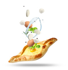 Khachapuri and ingredients in air on white background