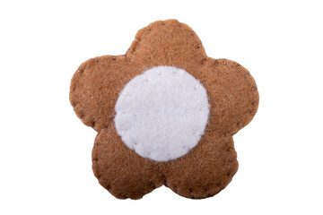 Brown and white flower-shaped figure made of felt fabric on white background