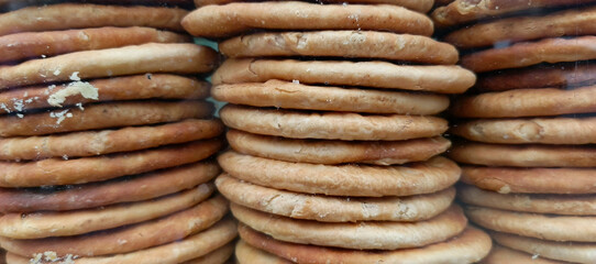 Stacked round flatbreads with golden brown crust and light interior baked goods food