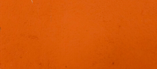 Textured orange surface with subtle imperfections and speckles background speckled